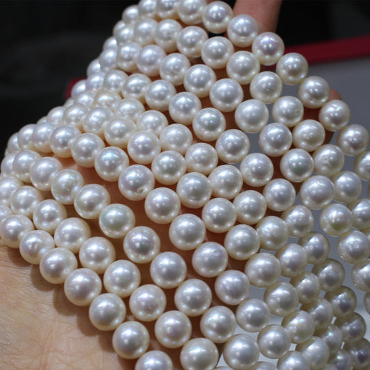 White color near round freshwater pearl strands