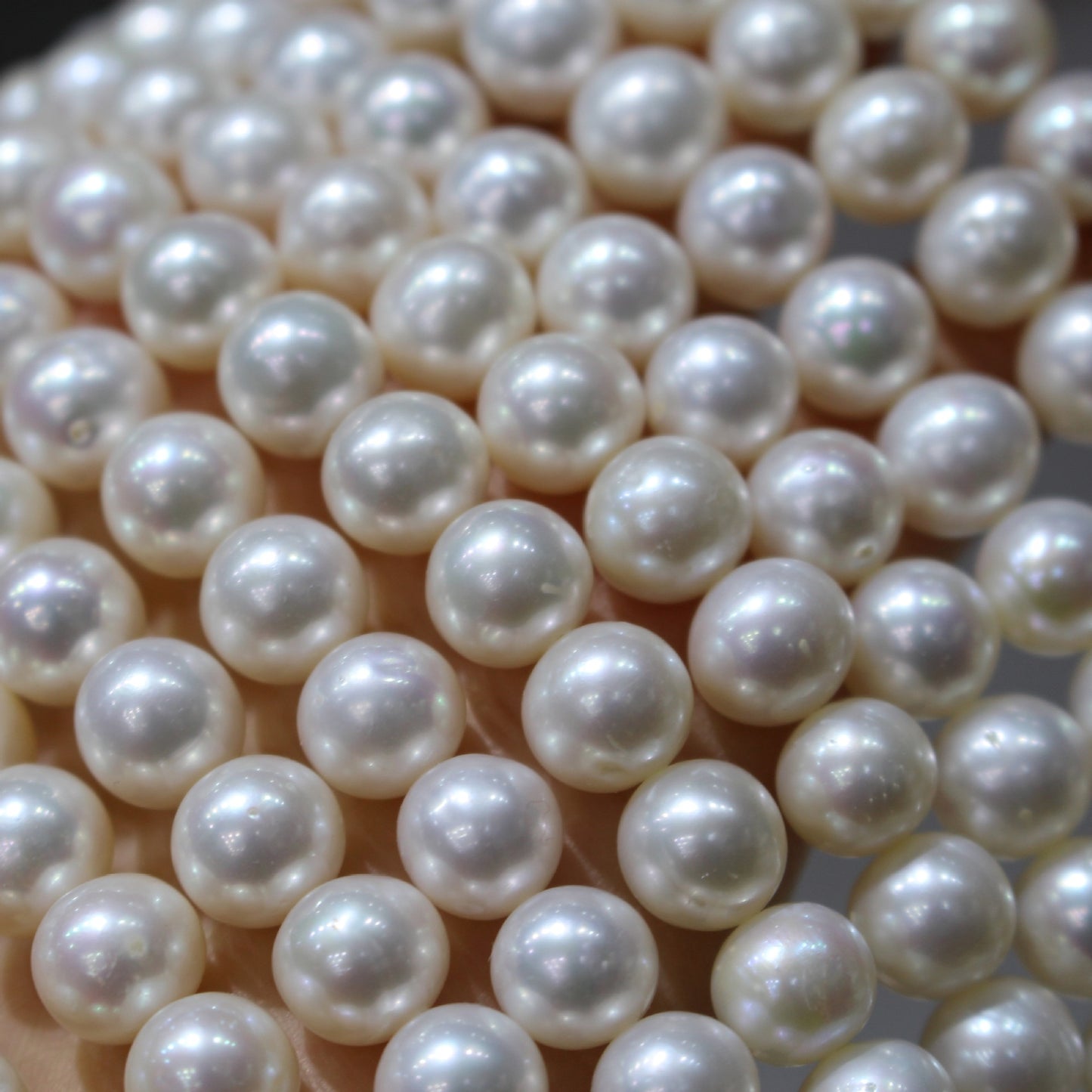 White color near round freshwater pearl strands