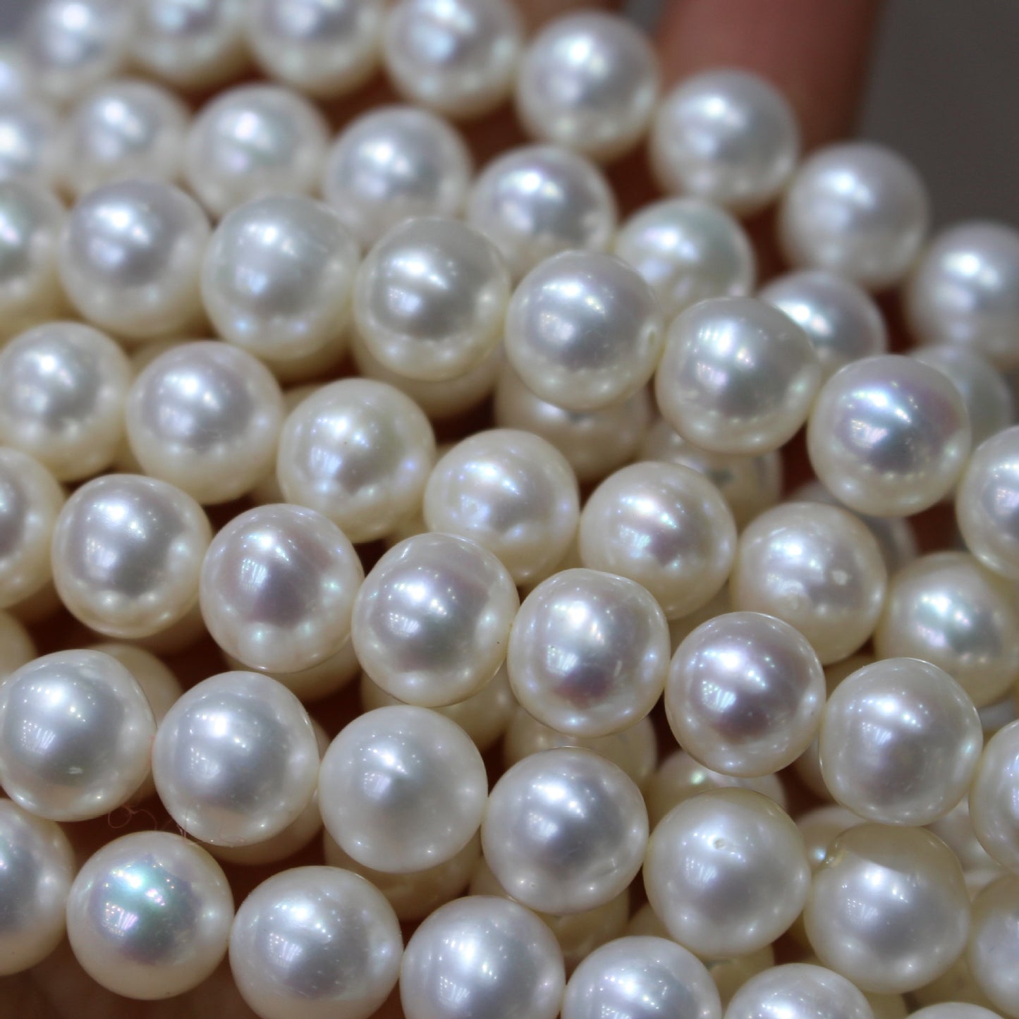 White color near round freshwater pearl strands