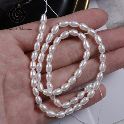 white cultured rice pearl strand